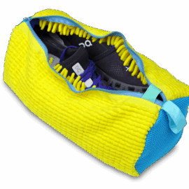 Yellow and blue duffel bag designed to wash shoes.